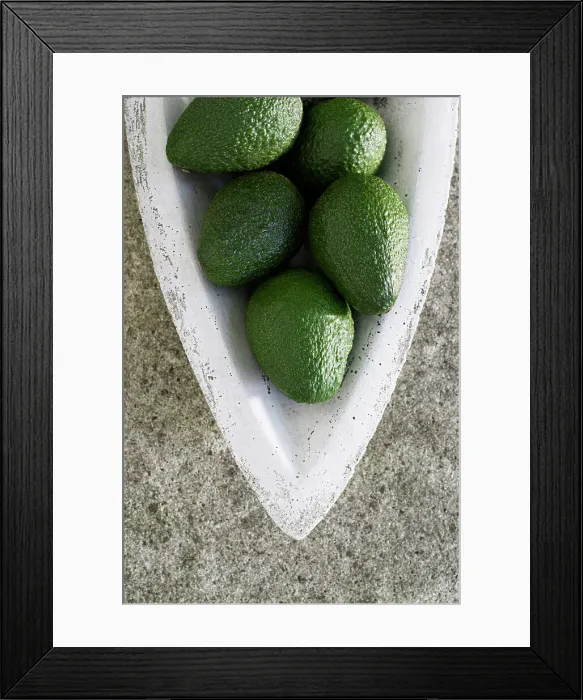 Framed Print : Avocado. Green avocados resting in a stone vessel Framed Print : Avocado. Green avocados resting in a stone vessel