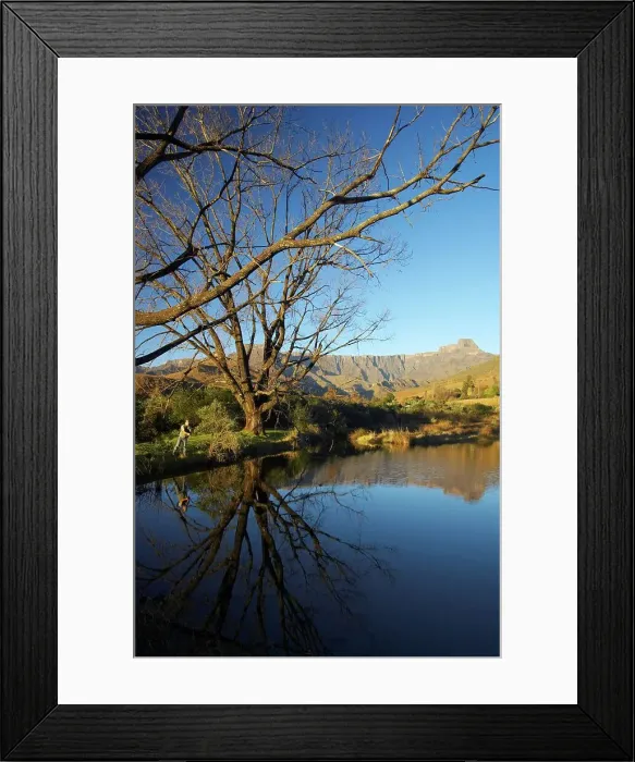 Framed Print : Fishing in the trout dam with the amphitheatre in the background Framed Print : Fishing in the trout dam with the amphitheatre in the background