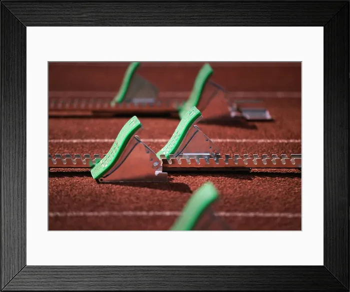 Framed Print : Starting blocks on running track Framed Print : Starting blocks on running track