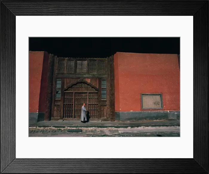 Framed Print : Monk standing outside of a temple, China Framed Print : Monk standing outside of a temple, China