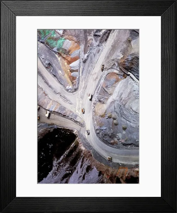 Framed Print : Aerial view of dump trucks on the road leading to the Grasberg Mine on the Jayawijaya Mountains Framed Print : Aerial view of dump trucks on the road leading to the Grasberg Mine on the Jayawijaya Mountains