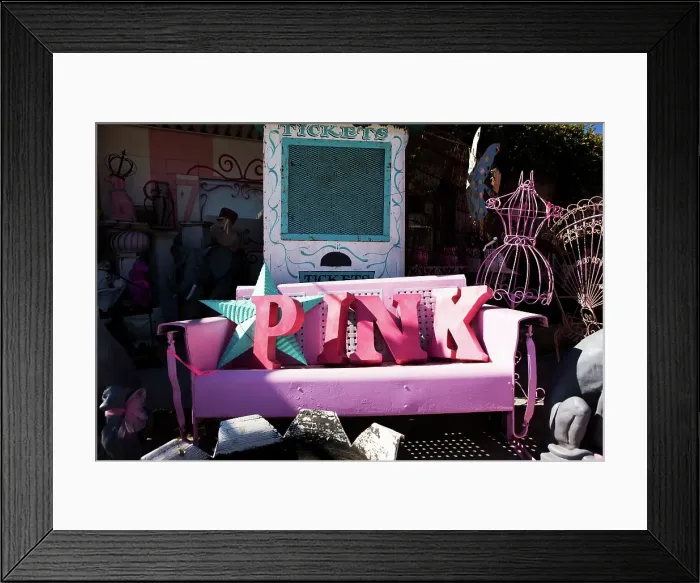 Framed Print : Letters spelling out the word PINK on a vintage iron bench at a curio shop Framed Print : Letters spelling out the word PINK on a vintage iron bench at a curio shop