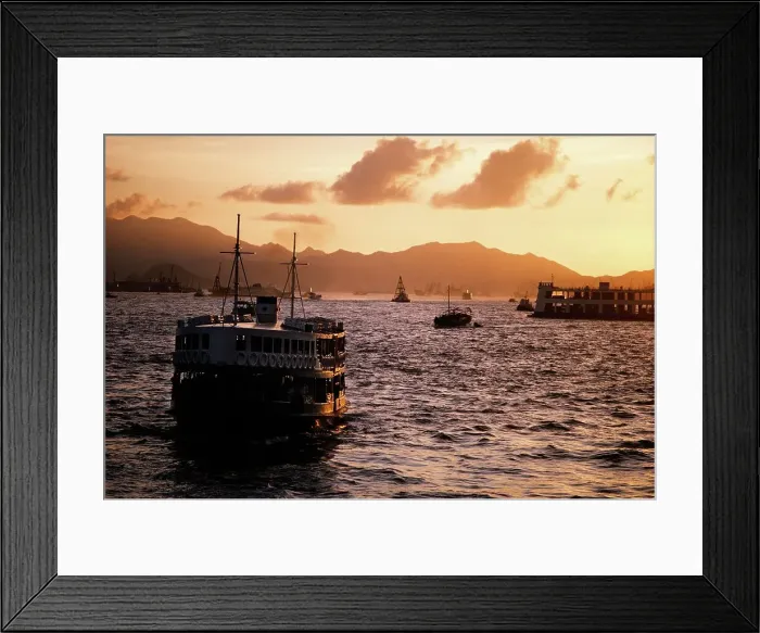 Framed Print : Star Ferry carrying passengers across Victoria Harbour at dusk Framed Print : Star Ferry carrying passengers across Victoria Harbour at dusk