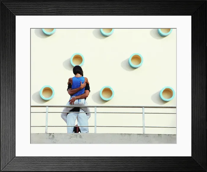 Framed Print : BLD067803. Couple kissing on balcony Framed Print : BLD067803. Couple kissing on balcony