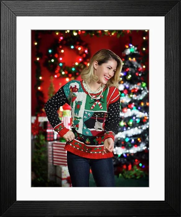 Framed Print : Portrait of woman in ugly Christmas sweater laughing and looking off camera
