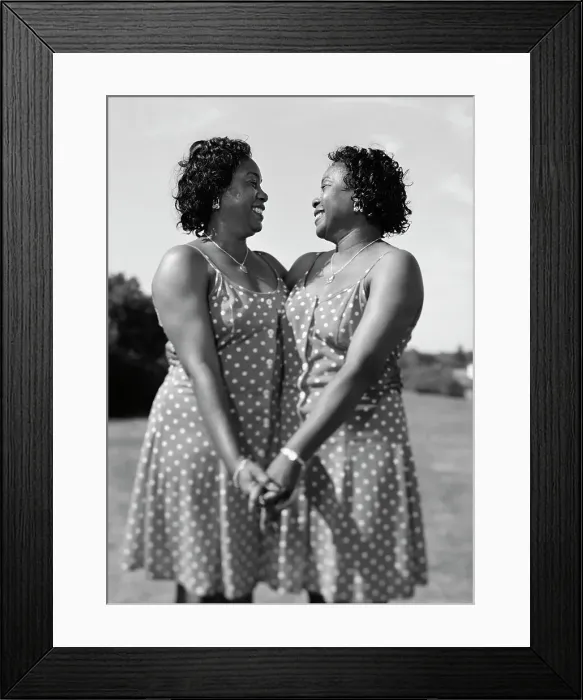 Framed Print : BLD001704. Portrait of women twins holding hands Framed Print : BLD001704. Portrait of women twins holding hands