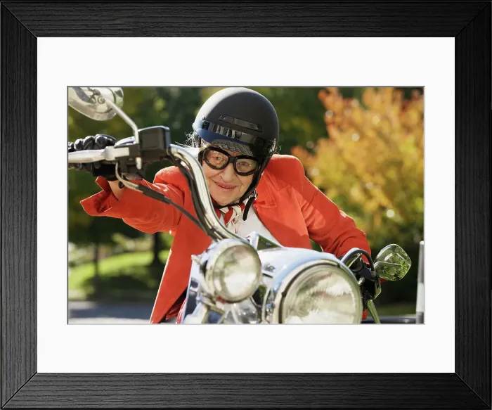 Framed Print : BLD016387. Elderly woman driving a motorcycle Framed Print : BLD016387. Elderly woman driving a motorcycle