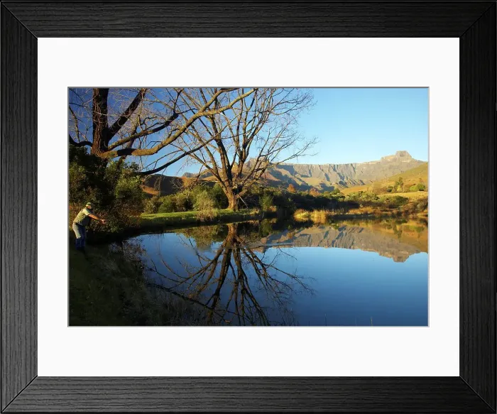 Framed Print : Fishing in the trout dam with the amphitheatre in the background Framed Print : Fishing in the trout dam with the amphitheatre in the background