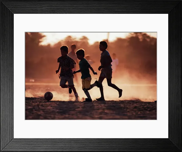 Framed Print : Boys playing soccer on the beach Framed Print : Boys playing soccer on the beach