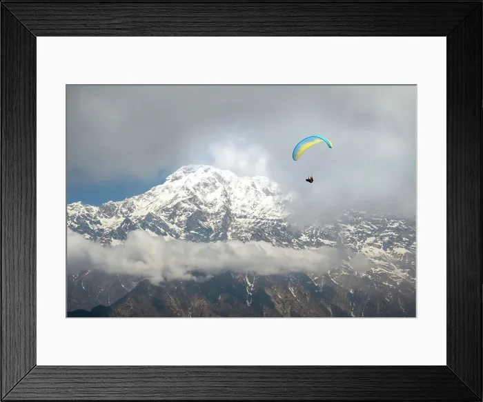 Framed Print : A man paragliding, Annapurna region, Himalayas near Pokhara, Nepal Framed Print : A man paragliding, Annapurna region, Himalayas near Pokhara, Nepal