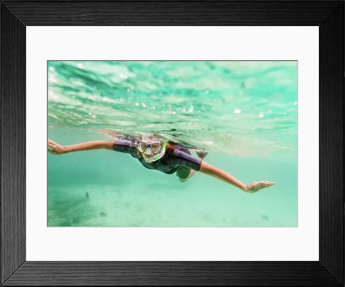Framed Print : Ecuador, Galapagos Islands, Woman snorkeling in sea Framed Print : Ecuador, Galapagos Islands, Woman snorkeling in sea