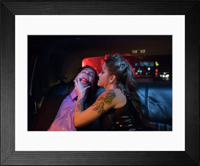 Framed Print : BLD069952. Dominatrix and man wearing ball gag in limousine Framed Print : BLD069952. Dominatrix and man wearing ball gag in limousine