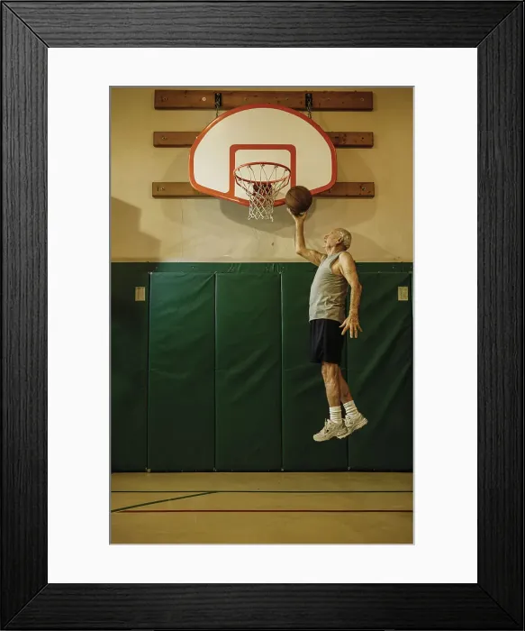 Framed Print : BLD016441. Elderly men jumping to slam dunk a basketball Framed Print : BLD016441. Elderly men jumping to slam dunk a basketball