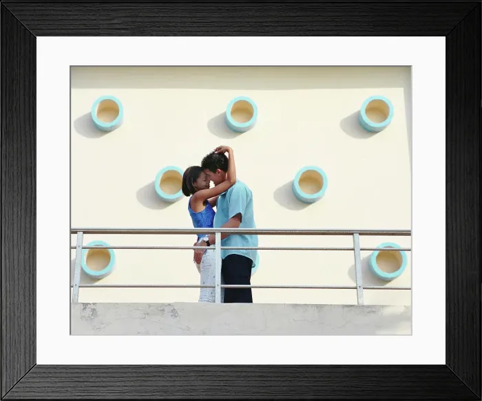 Framed Print : BLD067802. Couple kissing on balcony Framed Print : BLD067802. Couple kissing on balcony