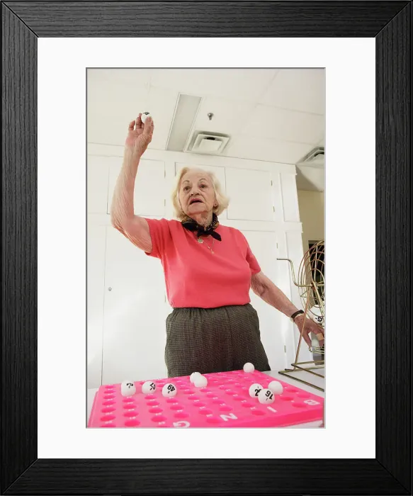 Framed Print : BLD016377. Elderly woman playing bingo Framed Print : BLD016377. Elderly woman playing bingo