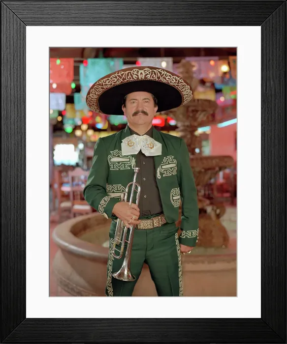 Framed Print : BLD046849. Hispanic mariachi musician holding trumpet