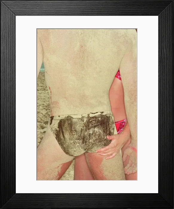 Framed Print : BLD081039. Hispanic couple at beach covered with sand Framed Print : BLD081039. Hispanic couple at beach covered with sand