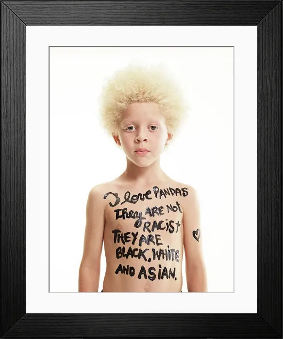 Framed Print : Portrait of Albino boy with words painted on body I love pandas, They are not racist, they are black, white and Asian Framed Print : Portrait of Albino boy with words painted on body I love pandas, They are not racist, they are black, white and Asian