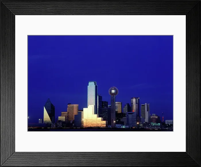 Framed Print : Downtown city skyline against a dark blue sky Framed Print : Downtown city skyline against a dark blue sky