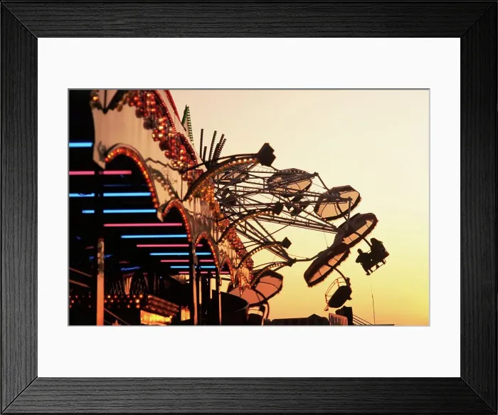 Framed Print : People riding a carnival way ride at sunset at the the Texas State Fair Framed Print : People riding a carnival way ride at sunset at the the Texas State Fair