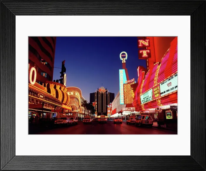 Framed Print : Vintage photo of Neon lights of casinos and restaurants lit up at night Framed Print : Vintage photo of Neon lights of casinos and restaurants lit up at night