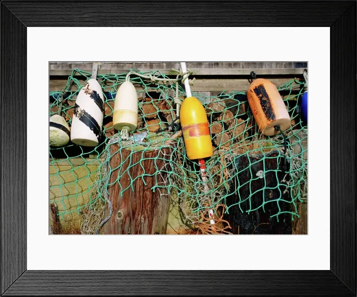 Framed Print : Buoys and a fishing net hanging to the edge of a dock at Menemsha Harbor Framed Print : Buoys and a fishing net hanging to the edge of a dock at Menemsha Harbor
