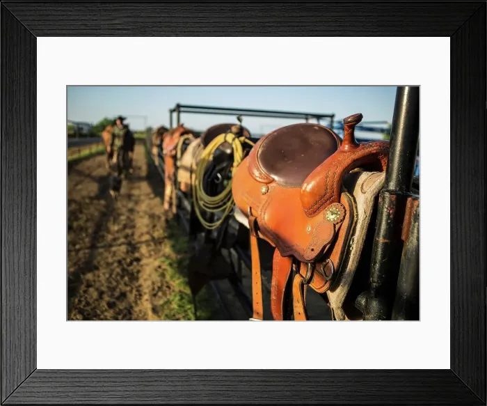 Framed Print : 4011-1447. Saddles resting on corral fence Framed Print : 4011-1447. Saddles resting on corral fence
