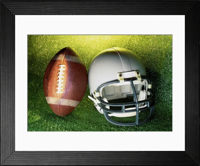 Framed Print : American football helmet and a football Framed Print : American football helmet and a football