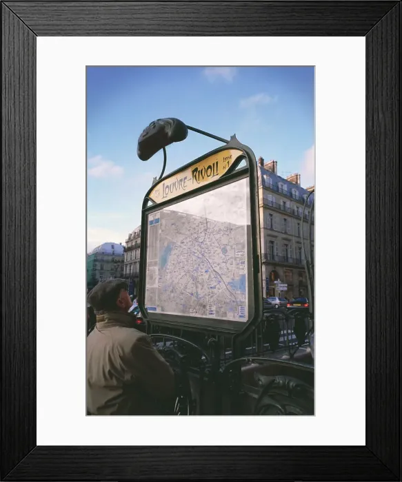 Framed Print : Tourist looking at metro map outside of the metro station