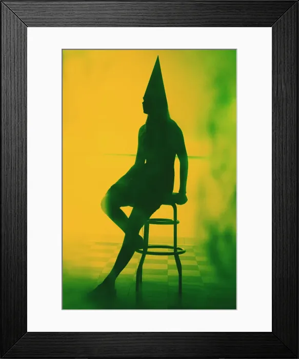 Framed Print : Silhouette of a woman wearing a dunce cap and sitting on a bar stool Framed Print : Silhouette of a woman wearing a dunce cap and sitting on a bar stool