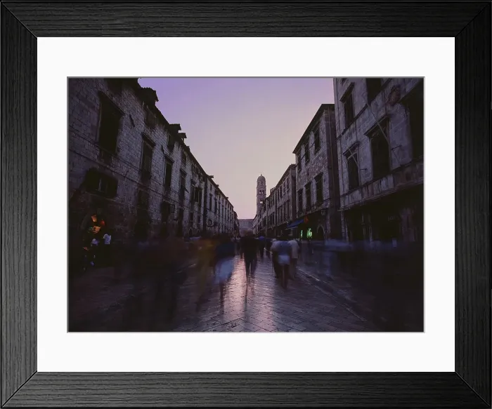 Framed Print : People on a busy street at dusk