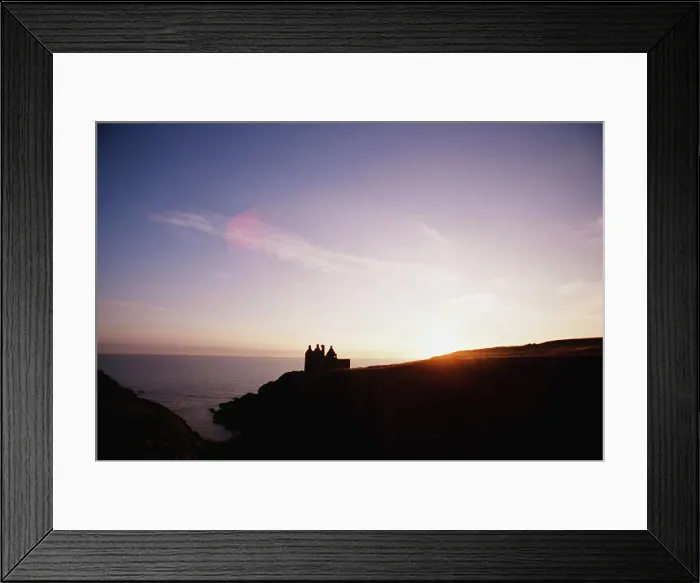 Framed Print : Silhouette of a stone castle on the coast Framed Print : Silhouette of a stone castle on the coast