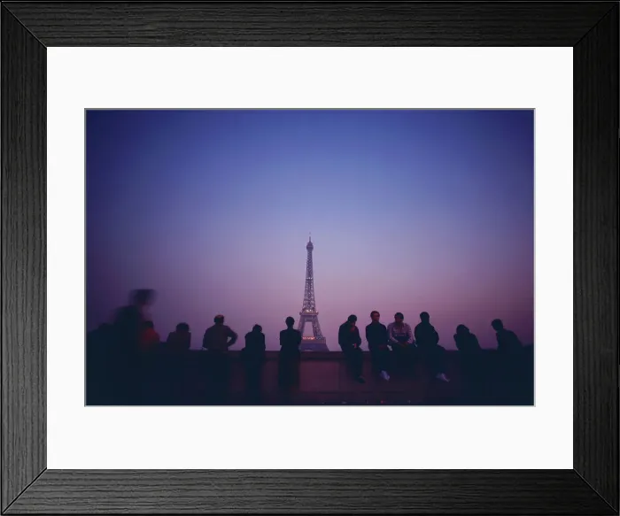 Framed Print : Tourists looking at a tower from an observation point Framed Print : Tourists looking at a tower from an observation point