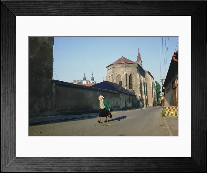Framed Print : Old woman walking on a down street Framed Print : Old woman walking on a down street