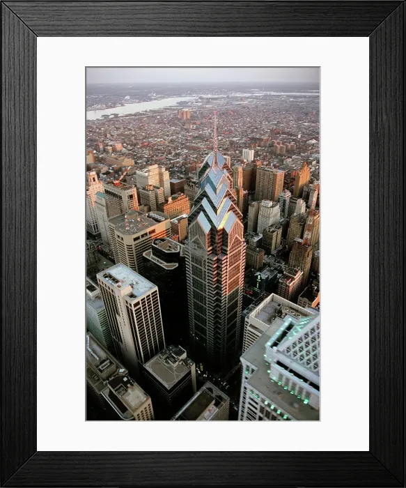 Framed Print : Aerial view of a cityscape with a river in the background Framed Print : Aerial view of a cityscape with a river in the background