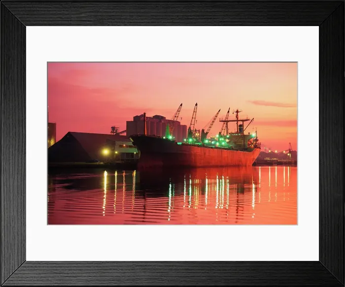 Framed Print : Container Ship docked at a commercial dock at dusk Framed Print : Container Ship docked at a commercial dock at dusk