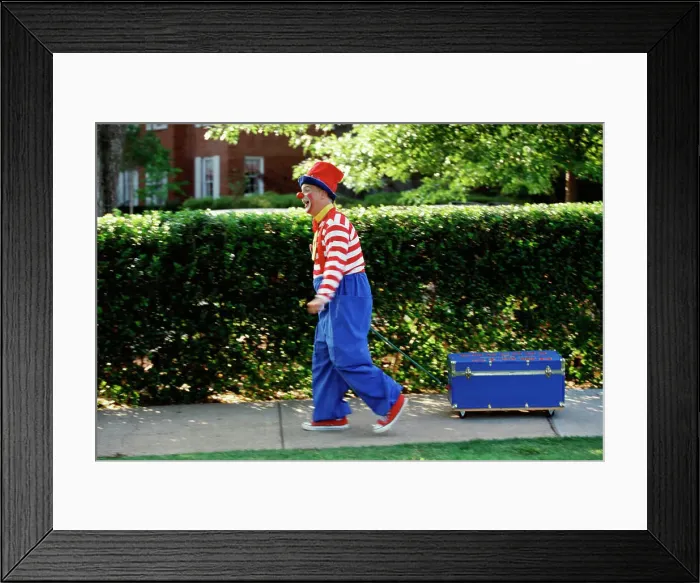 Framed Print : Clown pulling a wagon Framed Print : Clown pulling a wagon