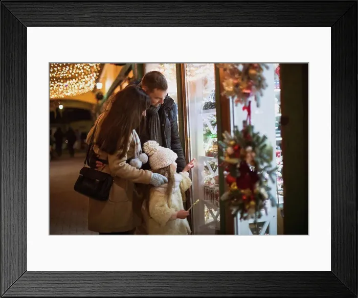 Framed Print : Family walk and look at the shop showcase with Christmas decorations Framed Print : Family walk and look at the shop showcase with Christmas decorations