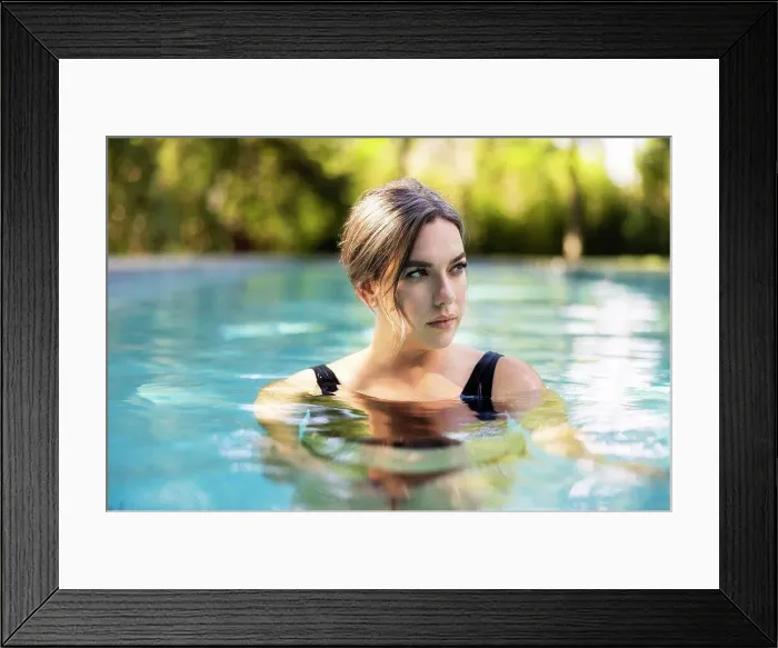 Framed Print : Portrait or caucasian woman floating in swimming pool in backyard Framed Print : Portrait or caucasian woman floating in swimming pool in backyard