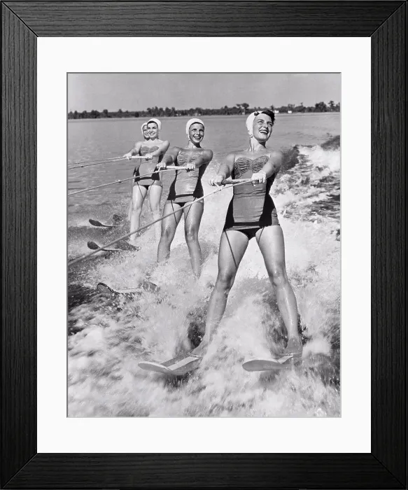 Framed Print : Four young women waterskiing in the sea Framed Print : Four young women waterskiing in the sea