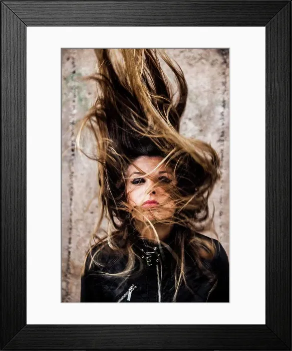 Framed Print : Young Woman Shaking Long Hair in Air