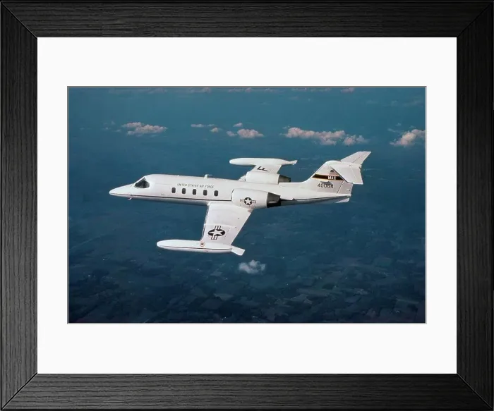 Framed Print : Aerial view of a C-21A aircraft in flight