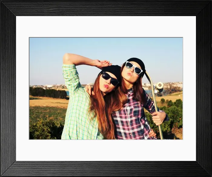 Framed Print : Two teen girl friends having fun together with skate board. Outdoors, urban lifestyle Framed Print : Two teen girl friends having fun together with skate board. Outdoors, urban lifestyle