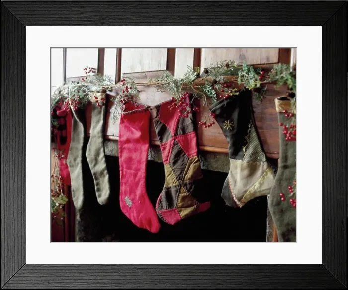 Framed Print : Close-up of Christmas stockings hanging on a mantelpiece