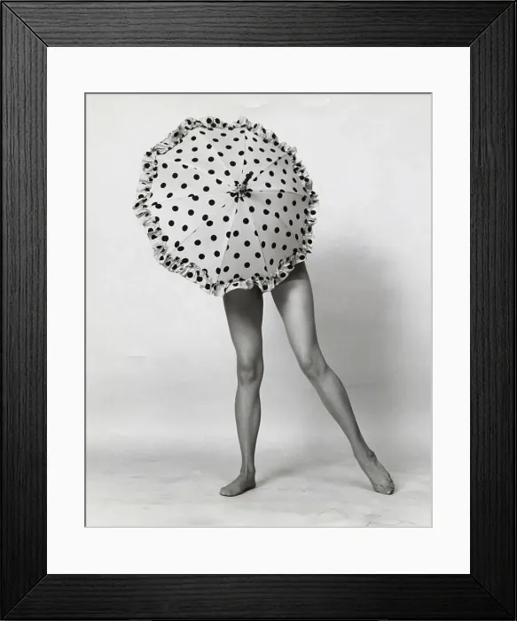Framed Print : Woman covering herself with an umbrella