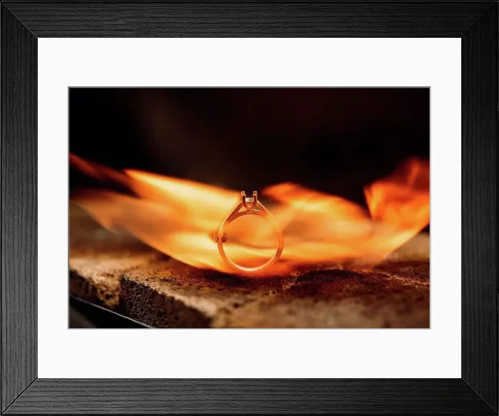 Framed Print : Close-up of burning silver ring in furnace at workshop Framed Print : Close-up of burning silver ring in furnace at workshop