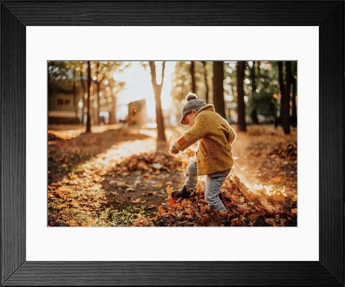 Framed Print : Stylish boy having fun in autumn city park Framed Print : Stylish boy having fun in autumn city park
