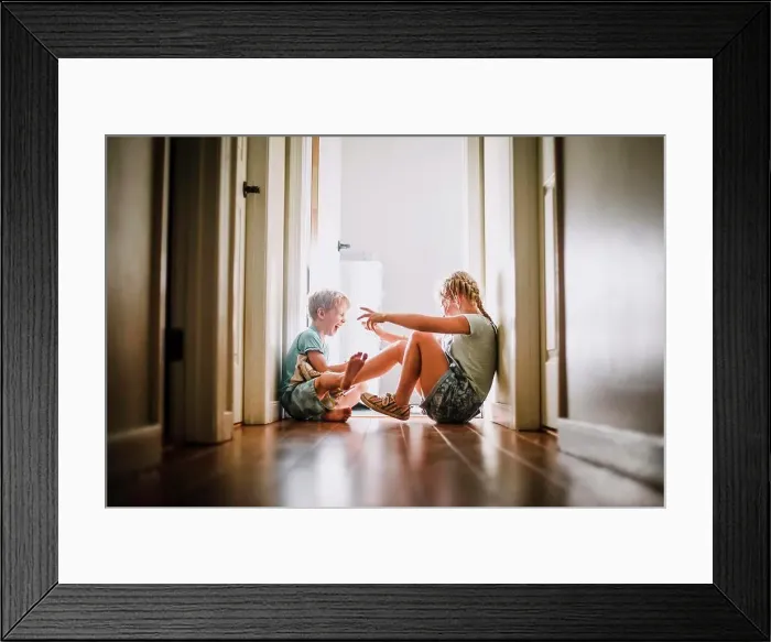 Framed Print : Brother and Sister Playing and Laughing in Bright Hallway Framed Print : Brother and Sister Playing and Laughing in Bright Hallway