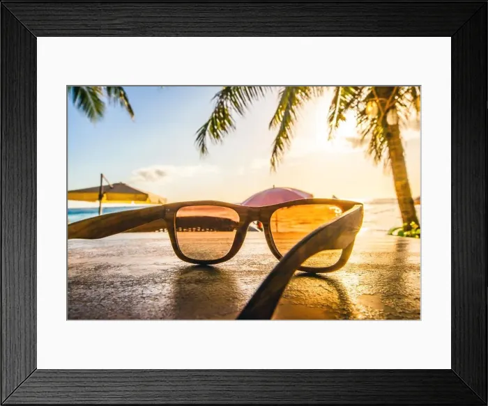 Framed Print : Sunglasses on beach. Sunglasses on tropical beach with palms at sunset Framed Print : Sunglasses on beach. Sunglasses on tropical beach with palms at sunset