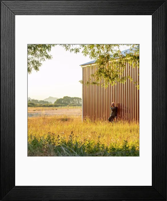 Framed Print : USA, Idaho, Bellevue, Farmer leaning against farm building and talking on phone Framed Print : USA, Idaho, Bellevue, Farmer leaning against farm building and talking on phone